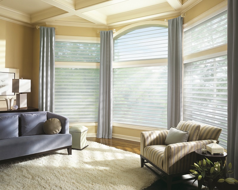 Add drapery to your bay window treatments for a custom look. 