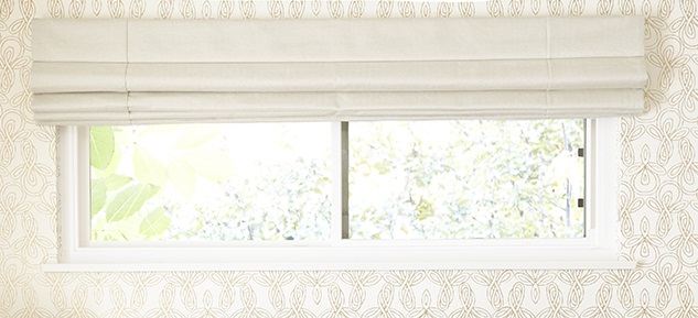 Window treatments in light colors can help brighten up your room.
