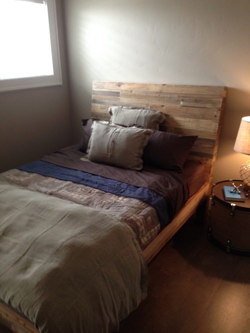 This child's bed uses repurposed wood for the headboard. 