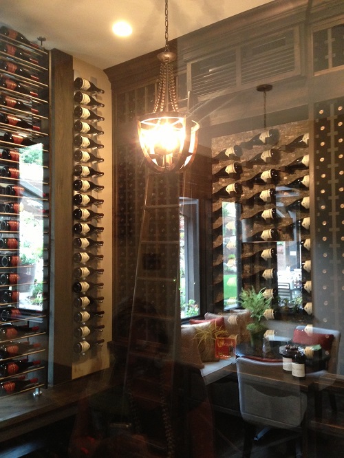 Vintage chic wine cellar with antique library ladder. 