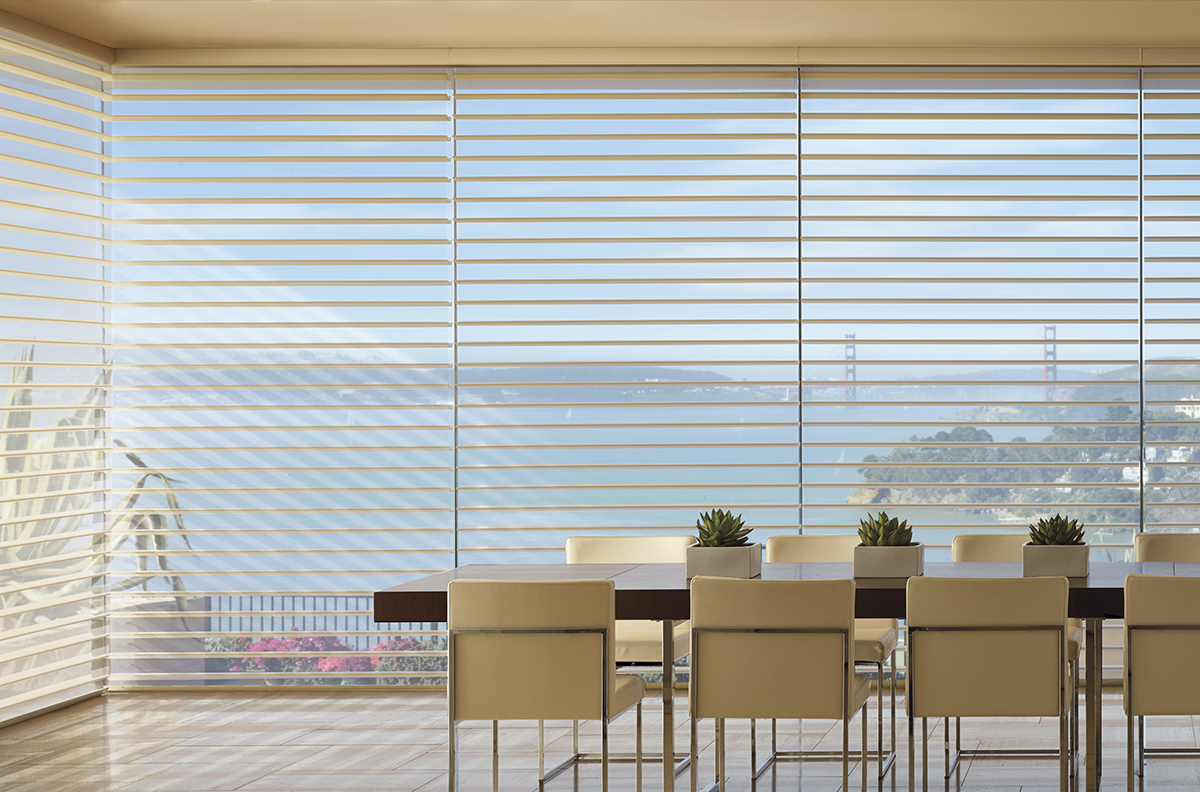 Silhouette window shadings with creams and earth tones helps to create a tranquil space.
