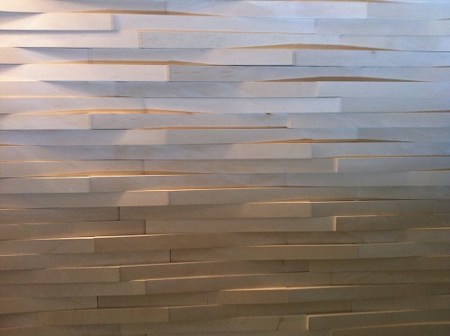 Textured tile adds interest and depth to a wall.