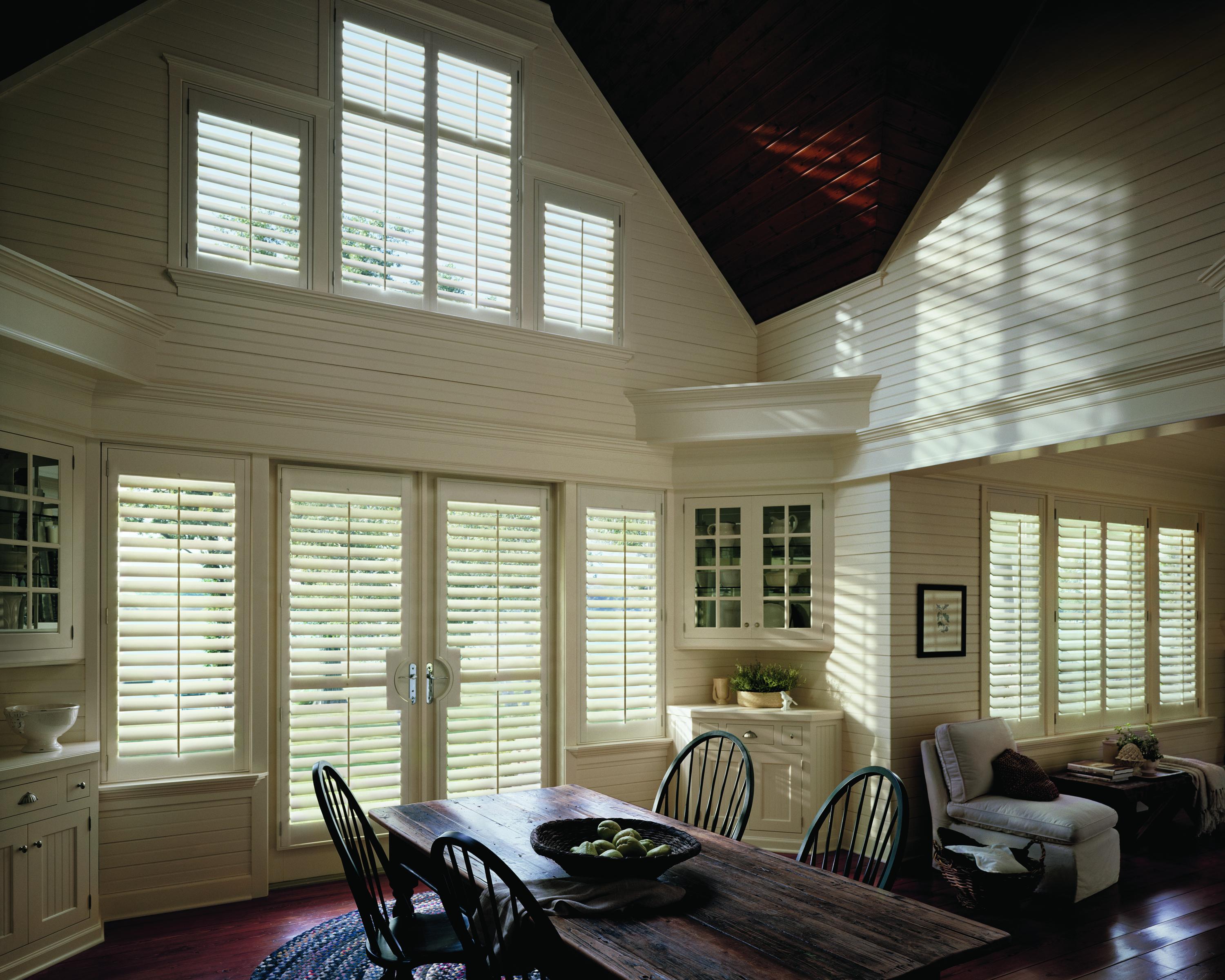 Colonial Americana style with white Hunter Douglas shutters